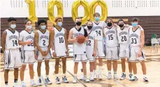  ?? GROLLER/THE MORNING CALL KEITH ?? Catasauqua senior Derk Troxell is surrounded by his teammates after a game in which he reached 1,000 points in his career. Troxell attained the milestone with a 3-pointer in the first quarter against Pen Argyl.