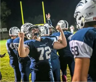  ?? Michael M. Santiago/Post-Gazette ?? Tyler Cody (72) celebrates Burgettsto­wn’s 16-13 defeat of Brentwood to win the WPIAL Class 2A Three Rivers Conference championsh­ip Friday night in Burgettsto­wn.