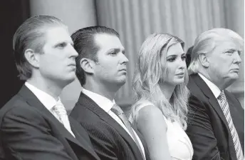  ?? PAUL MORIGI Getty Images ?? President Donald Trump with three of his adult children, from left, Eric, Donald Jr., and Ivanka.