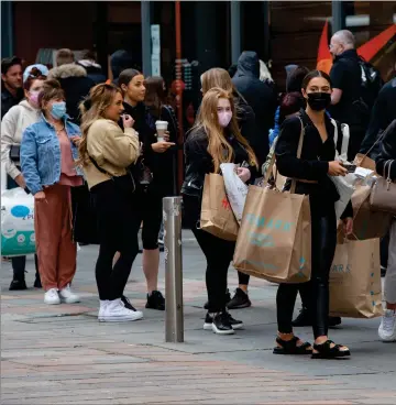  ??  ?? Shoppers on Buchanan Street, Glasgow, yesterday, as shops, cafes, pubs, hospitalit­y venues, gyms and museums reopened