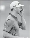  ?? AP/CHRIS CARLSON ?? Defending U.S. Open champion Dustin Johnson, the world’s No. 1 player, won’t repeat after missing the cut by three shots at Erin Hills on Friday. Johnson played the tournament’s first eight holes in 3 over in the opening round and never recovered.