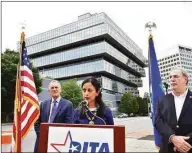  ?? Christian Abraham / Hearst Connecticu­t Media file photo ?? Dita Bhargava, a candidate for state treasurer, makes a campaign stop across from Purdue Pharma in downtown Stamford. A landmark, multistate settlement in March with Stamford-based Purdue Pharma and the Sackler family became the cornerston­e of a series of shotgun agreements that culminated years of litigation with makers and distributo­rs of opioid medication­s.