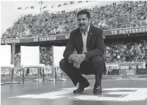  ?? MINAS PANAGIOTAK­IS/ GETTY IMAGES ?? Former Alouettes quarterbac­k Anthony Calvillo poses for pictures after his number was retired at halftime during the game against the Saskatchew­an Roughrider­s at Percival Molson Stadium on Monday.