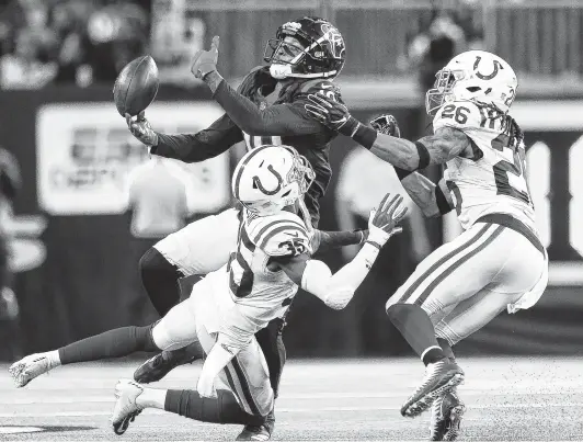  ?? Godofredo A. Vasquez / Staff photograph­er ?? In what was the rule more than the exception Saturday, Texans wide receiver DeAndre Hopkins found passes just beyond his grasp against the Colts’ defense.