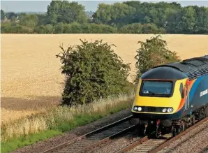  ?? PAUL BIGGS. ?? The Transport Select Committee has criticised Government’s response to its infrastruc­ture report. One of the TSC’s suggestion­s was to reclassify the Midland Main Line electrific­ation to ‘pending’ rather than cancelled. On July 26, East Midlands Trains 43465 and 43480 pass Cossington on the MML, with the 0731 Derby-St Pancras Internatio­nal.