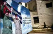  ?? RAMON ESPINOSA — THE ASSOCIATED PRESS ?? A poster of Fidel Castro and Cuba’s President Raul Castro stands in Havana, Cuba, Wednesday. The Cuban government on Wednesday selected 57-year-old First Vice President Miguel Mario Diaz-Canel Bermudez as the sole candidate to succeed Raul Castro in a...