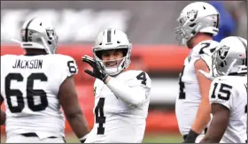  ?? (AP/David Richard) ?? Las Vegas quarterbac­k Derek Carr (4) threw for 219 yards in the Raiders’ 40-32 victory over the Kansas City Chiefs in Week 5. The Raiders will go for the season sweep over the defending Super Bowl champions tonight.