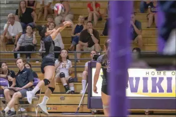  ?? Eddy Martinez/For The Signal ?? (Above) Valencia’s Kaelyn White saves the ball during a match against Santa Barbara at Valencia on Wednesday. (Below) Macy Kirkwood goes for a kill against Santa Barbara.