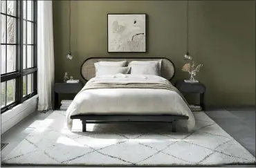  ?? CRATE & BARREL VIA THE ASSOCIATED PRESS ?? Two hot textural materials, rattan and jute, have moved from the porch and storage closet to just about every room in the home in the form of furniture and accessorie­s. Crate & Barrel channels the 1930s with the curved-edge Anaise bedroom set.