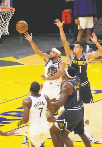  ?? Carlos Avila Gonzalez / The Chronicle ?? Stephen Curry keeps his eyes on the prize on a firsthalf shot Saturday night at Chase Center in San Francisco. He showed flashes of his old self after playing just five games last season.