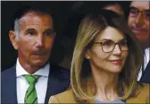  ?? STEVEN SENNE — THE ASSOCIATED PRESS FILE ?? Actor Lori Loughlin and her husband Mossimo Giannulli depart federal court in Boston after facing charges in a nationwide college admissions bribery scandal.