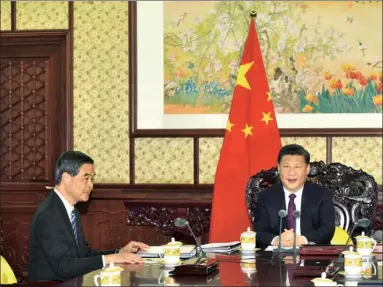  ?? PROVIDED TO CHINA DAILY ?? President Xi Jinping (right) meets Chief Executive Leung Chun-ying in Beijing on Friday. Leung briefed President Xi on the latest economic, social and political developmen­ts in Hong Kong.