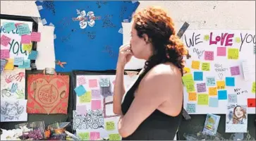  ?? Christina House Los Angeles Times ?? A MEMORIAL in Silver Lake for Melyda Corado, the Trader Joe’s manager who was killed in a shootout between a gunman and police. One hostage who complied with the man’s demands is shaken by the incident.