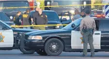  ?? DEAN HANSON/JOURNAL ?? Bernalillo County Sheriff’s deputies at the scene of the fatal shooting of Elisha Lucero in July 2019.