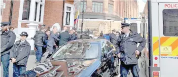  ?? — Reuters photo ?? Assange is carried by Metropolit­an Police officers during his arrest and taken into custody following the Ecuadorian government’s terminatio­n of asylum, in London.