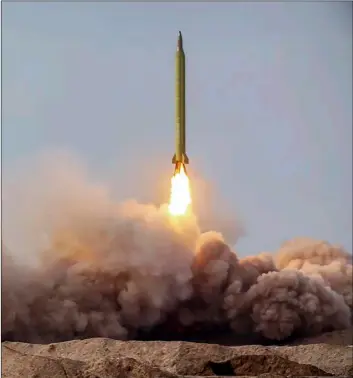  ?? Iranian Revolution­ary Guard/Sepahnews via AP ?? In this photo released on Saturday by the Iranian Revolution­ary Guard, a missile is launched in a drill in Iran.