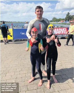  ??  ?? Lucy Scott with twin sister Molly and dad Luke at the triathlon