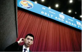  ??  ?? A security guard stands at the entrance to the opening ceremony of the Belt and Road Forum in Beijing. (Reuters)