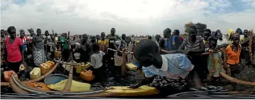  ?? PHOTO: GETTY IMAGES ?? Refugees fleeing war-torn South Sudan, where famine has just been declared, wait to collect water.