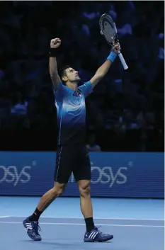  ?? ASSOCIATED PRESS ?? Serbia's Novak Djokovic celebrates winning match point from Spain’s Rafael Nadal during their ATP World Tour Finals tennis match at the O2 Arena in London, England.