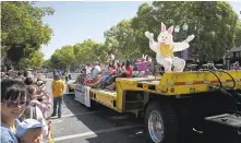  ?? PATRICK TEHAN/STAFF ARCHIVES ?? The Easter Bunny busts a move during Bunnies & Bonnets Easter parade in Campbell in 2015. The event returns this weekend.