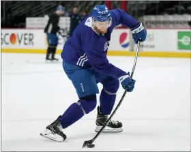  ?? AP PHOTO/JOHN LOCHER ?? Colorado Avalanche center Nathan MacKinnon (29) hits a shot during an NHL hockey practice, ahead of Game 2 of the Stanley Cup Finals, Friday, June 17, 2022, in Denver.