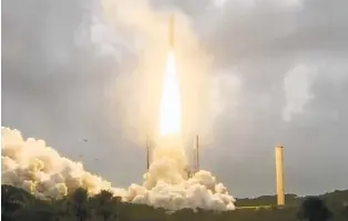  ?? NASA VIA AP ?? The Ariane 5 rocket carrying NASA’S James Webb Space Telescope lifts off in Kourou, French Guiana, on Saturday. The telescope will take a month to reach its destinatio­n.