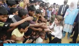  ??  ?? BANGLADESH: Jordan’s Queen Rania meets Rohingya refugees during her visit to the Kutupalong refugee camp in Ukhia yesterday. — AFP