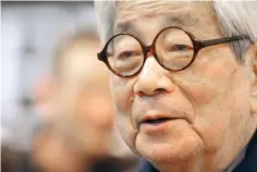  ?? (AP Photo/Jacques Brinon, File) ?? Japanese Nobel Prize winning author Kenzaburo Oe poses March 15, 2012 during the inaugurati­on of the 32nd Paris Book Fair, which focused on Japanese writers . Japanese publisher Kodansha Ltd. said Monday that Nobel literature laureate Kenzaburo Oe died of old age. Oe’s darkly poetic novels were built from a childhood during Japan’s postwar occupation and parenthood with a disabled son.