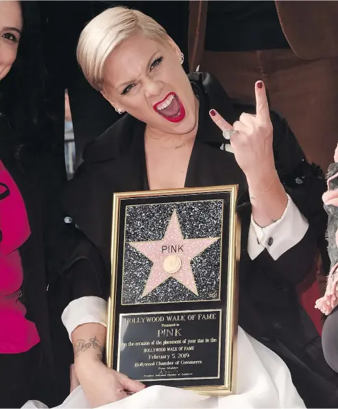  ?? — GETTY IMAGES FILES ?? Pink got her star on the Hollywood Walk of Fame Feb. 5, next to Dwayne ‘The Rock’ Johnson.