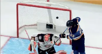  ?? (AP PHOTO/JEFF ROBERSON) ?? St. Louis Blues' Jake Neighbours (63) scores past Anaheim Ducks goaltender Lukas Dostal during the third period of Sunday’s game, in St. Louis.