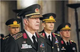  ?? THE ASSOCIATED PRESS ?? Chief of general staff Gen. Hulusi Akar stands with other military chiefs during a Supreme Military Council meeting Thursday in Ankara, Turkey.