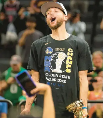  ?? STEVEN SENNE/AP ?? Stephen Curry celebrates after the Warriors won the NBA Finals on Thursday in Boston.