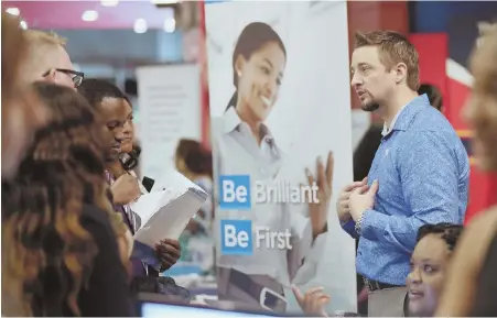  ?? APFILEPHOT­OS ?? HELP WANTED: Chad Beutler of First Data, right, talks with applicants at a June 21 job fair in Sunrise, Fla. U.S. job growth has defied prediction­s of a slowdown despite an unemployme­nt rate of 3.7 percent — the lowest since 1969.