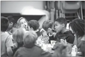  ?? NWA Democrat-Gazette/SPENCER TIREY ?? Blake Crowe (from right) enjoys his Tuesday lunch with Jeremy Shook, Harrison Placzek and Aubrey Scallan along with other fourth-graders from Nicole Anderson’s class at Sugar Creek Elementary School in Bentonvill­e.