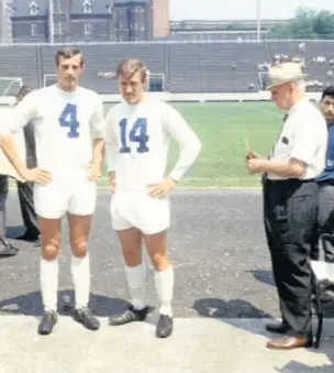  ??  ?? John Holsgrove is pictured with Fred Davies (14) and physio George Palmer at the Varsity Stadium in Toronto, Ontario.