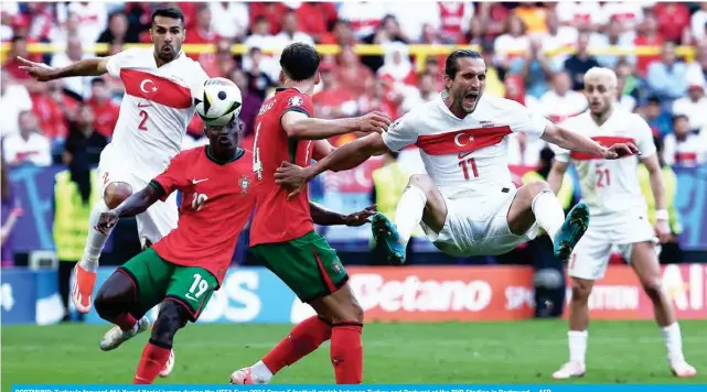  ?? – AFP ?? DORTMUND: Turkey’s forward #11 Yusuf Yazici jumps during the UEFA Euro 2024 Group F football match between Turkey and Portugal at the BVB Stadion in Dortmund.