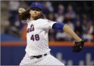  ?? FRANK FRANKLIN II — THE ASSOCIATED PRESS FILE ?? New York Mets starting pitcher Jacob deGrom throws during the first inning of the team’s baseball game against the Atlanta Braves Wednesday, in New York. The scoreboard at Citi Field showed DeGrom hitting 98 mph that night, and the ballpark buzzed with...