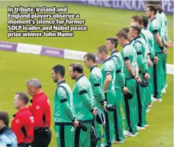  ??  ?? In tribute: Ireland and England players observe a moment’s silence for former SDLP leader and Nobel peace prize winner John Hume