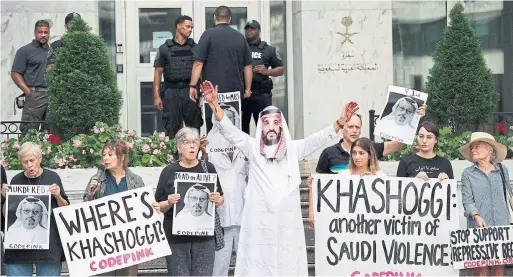  ?? JIM WATSON AFP/GETTY IMAGES ?? Protesters outside the Saudi Embassy in Washington are urging authoritie­s at the “highest level” to step in regarding the case of missing journalist Jamal Khashoggi.