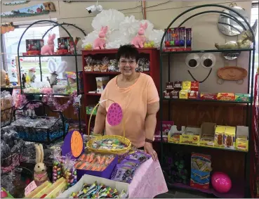  ?? BILL DEBUS — THE NEWS-HERALD ?? Candy Nichols, owner of the Red Berry Candy Shop in Madison Village, poses for a photo inside her store on March 23. The Red Berry Candy Shop opened 15years ago and has become a popular place for seekers of sweet treats.