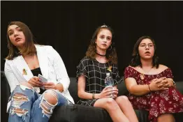  ??  ?? From left, Santa Fe High School students Megan McGuire, 17, Bree Butler, 18, and Kennedy Rodriguez, 18, take questions on gun safety and preventive measures.