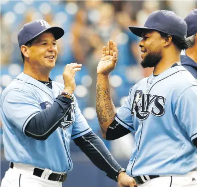  ?? REINHOLD MATAY / THE CANADIAN PRESS FILES ?? Charlie Montoyo, left, has been tapped by the Toronto Blue Jays as manager after 18 years coaching in the Tampa Rays system — including management jobs at every minor-league level.