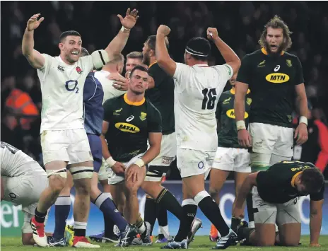  ??  ?? England players celebrate after their battling 12-11 win over South Africa at Twickenham in their opening autumn internatio­nal