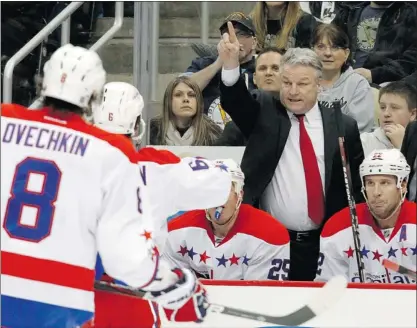  ?? — GETTY FILES PHOTOS ?? Head coach Dale Hunter directs the Caps team during a 4-3 OT loss at Pittsburgh.