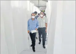  ?? SATYABRATA TRIPATHY/HT PHOTO ?? State health minister Rajesh Tope (in blue) visits the 200-bed dedicated Covid Care Centre set up within 14 days at Nature Park in Dharavi, on Monday.