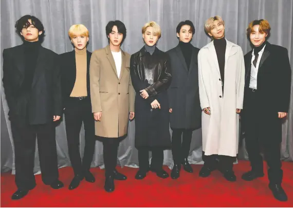  ?? EMMA MCINTYRE/GETTY IMAGES ?? V, left, Suga, Jin, Jungkook, RM, Jimin and J-hope of BTS pose at this year’s Grammys. Nearly everything this K-pop group touches these days turns to gold.