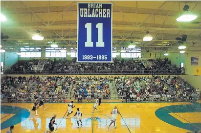  ?? JOURNAL FILE ?? This photo shows the Brian Urlacher banner hanging over the Lovington basketball court during Urlacher’s 2004 All-Star charity game. Urlacher, a Lovington alum, will be inducted into the NFL Hall of Fame on Saturday.