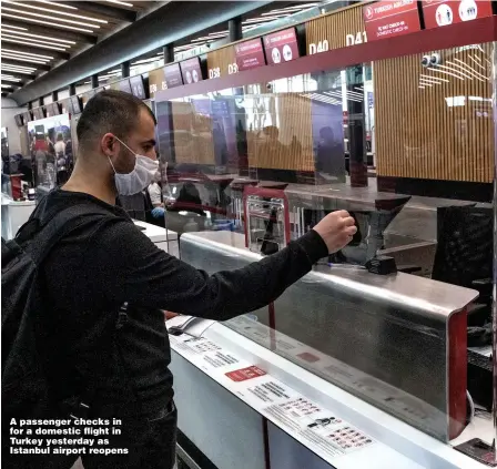  ?? Pictures: GETTY & PINPEP ?? A passenger checks in for a domestic flight in Turkey yesterday as Istanbul airport reopens