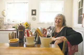  ?? Photos by Liz Hafalia / The Chronicle ?? Dana Velden, above, in her Oakland kitchen, lived and cooked at the S.F. Zen Center for 15 years. Top: Enjoying a cup of tea can become a meditation.